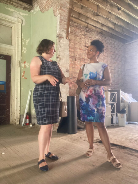 Janice Monger and Laurie Cumbo inside building B before construction